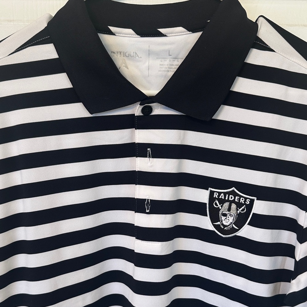 Antigua Raiders Men's Black and White Striped Polo Shirt